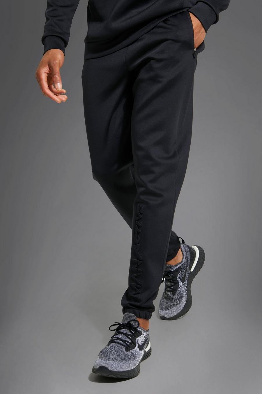 Black negro מכנסי ריצה ספורטיביים מבד סקובה עם כיתוב Man בתבליט
