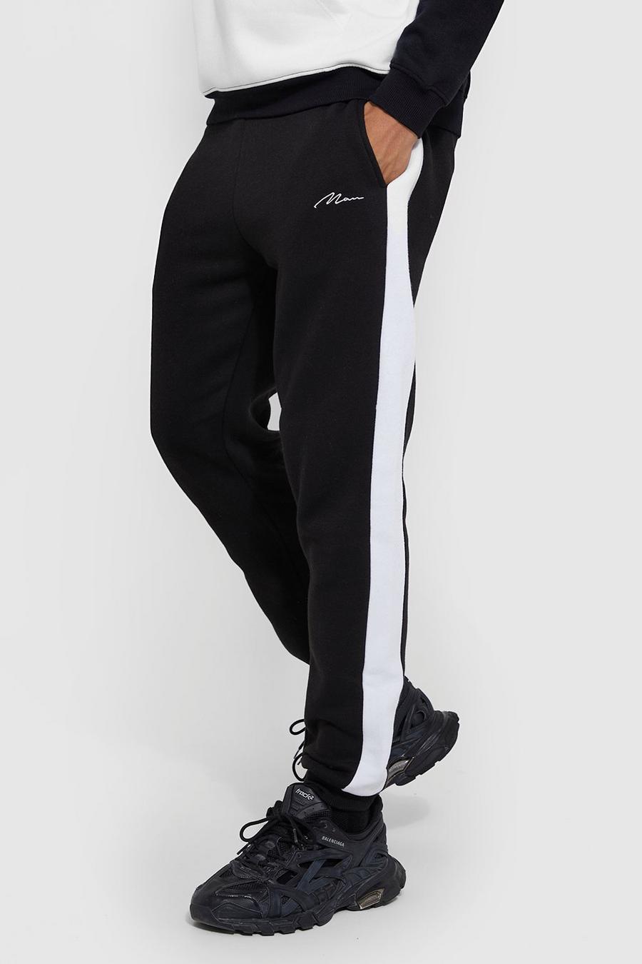 Pantalón deportivo Tall pitillo con letras MAN y panel lateral, Black image number 1
