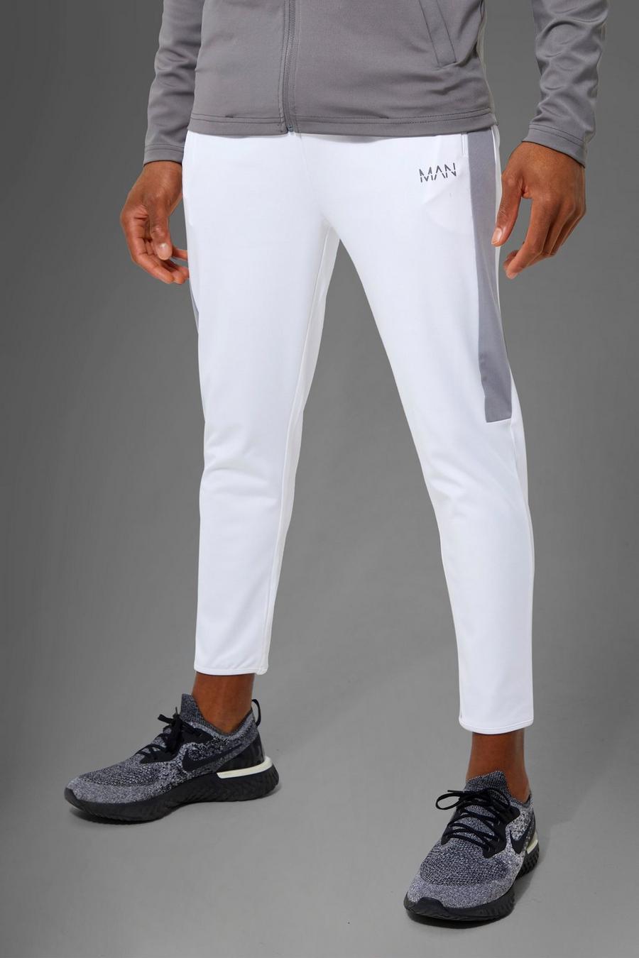 White מכנסי ריצה קרופ ספורטיביים עם פאנל צדדי וכיתוב Man