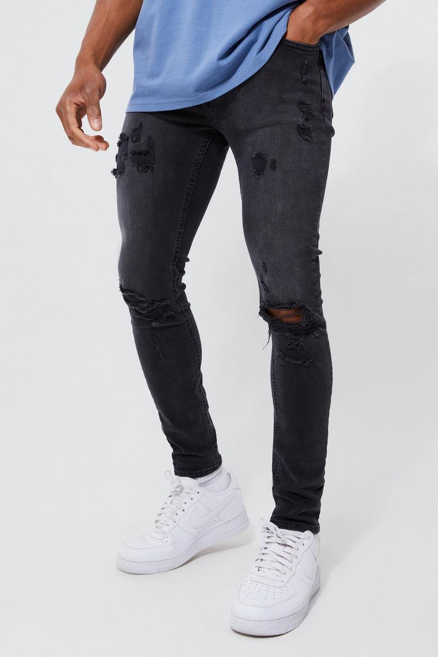 שחור דהוי ג'ינס סקיני נמתח עם קרעים גדולים בברך image number 1