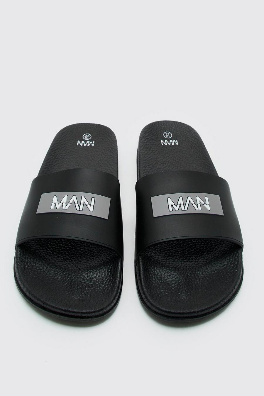 Black Man Slippers Met Logo image number 1