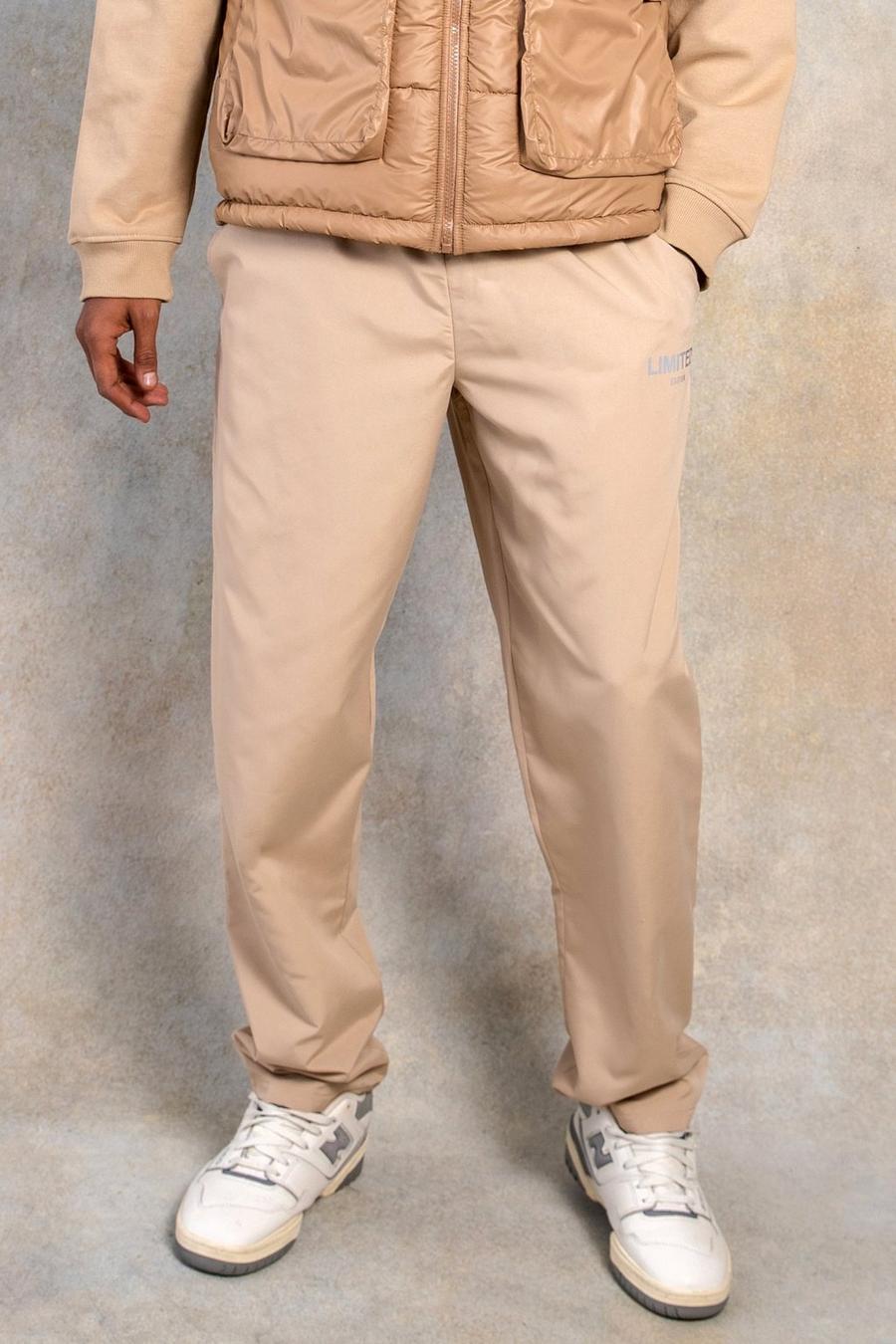 אבן beige מכנסיים בגזרה ישרה מבד עמיד בצבע אפרסק עם כיתוב Limited