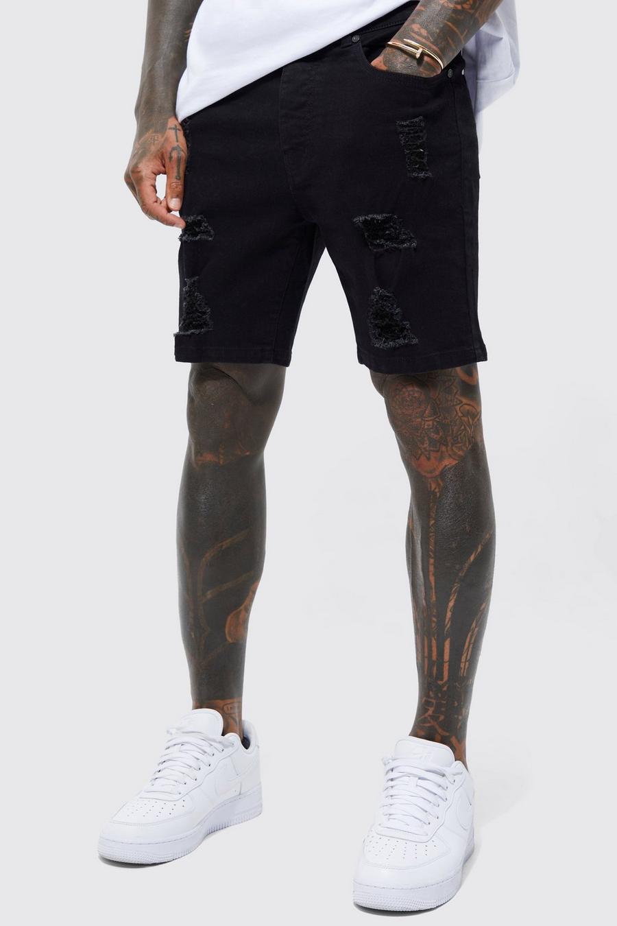 שחור אמיתי שורט סקיני מבד ג'ינס נמתח עם קרעים מרובים 