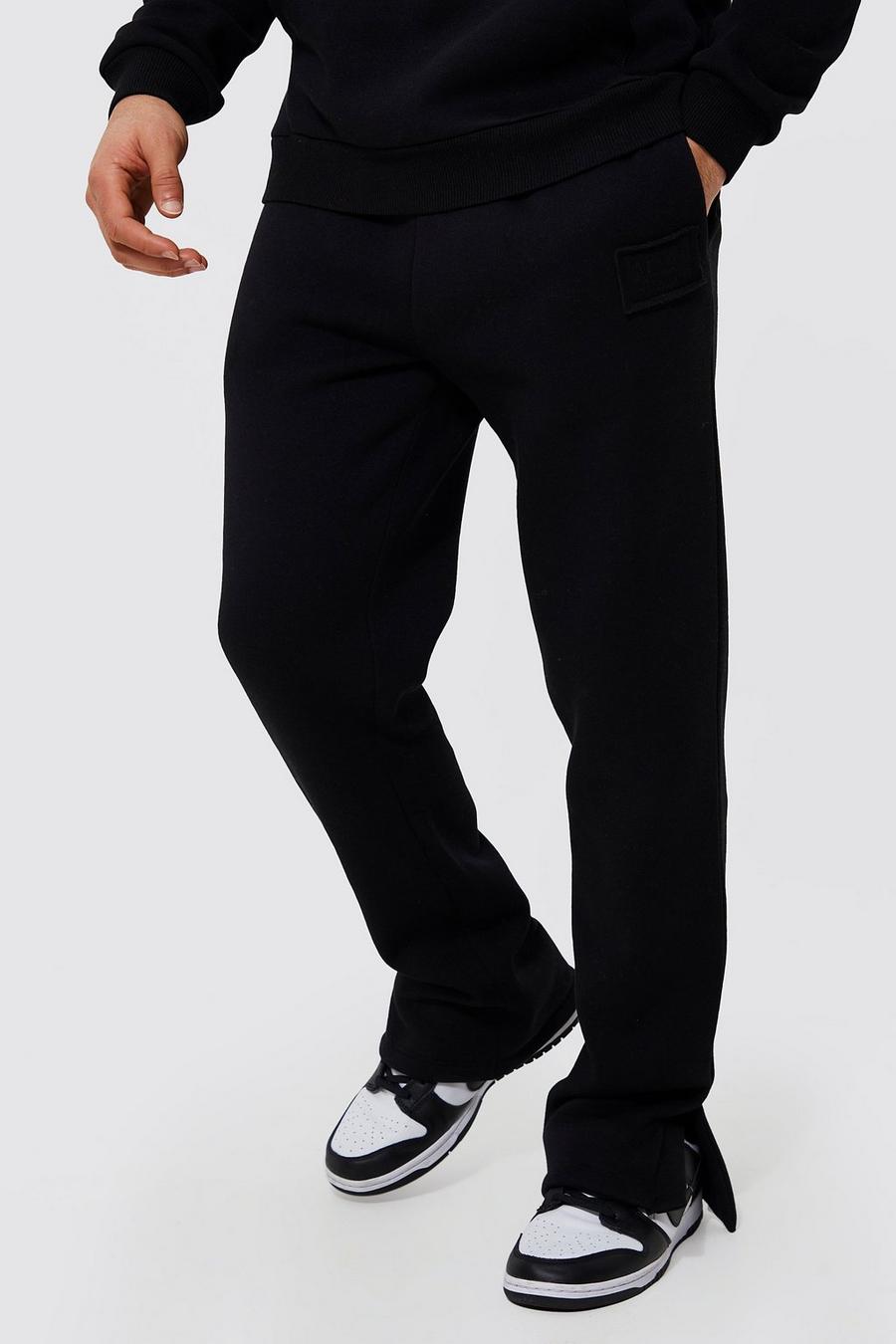 Pantalón deportivo con abertura en el bajo y emblema desgastado, Black nero image number 1