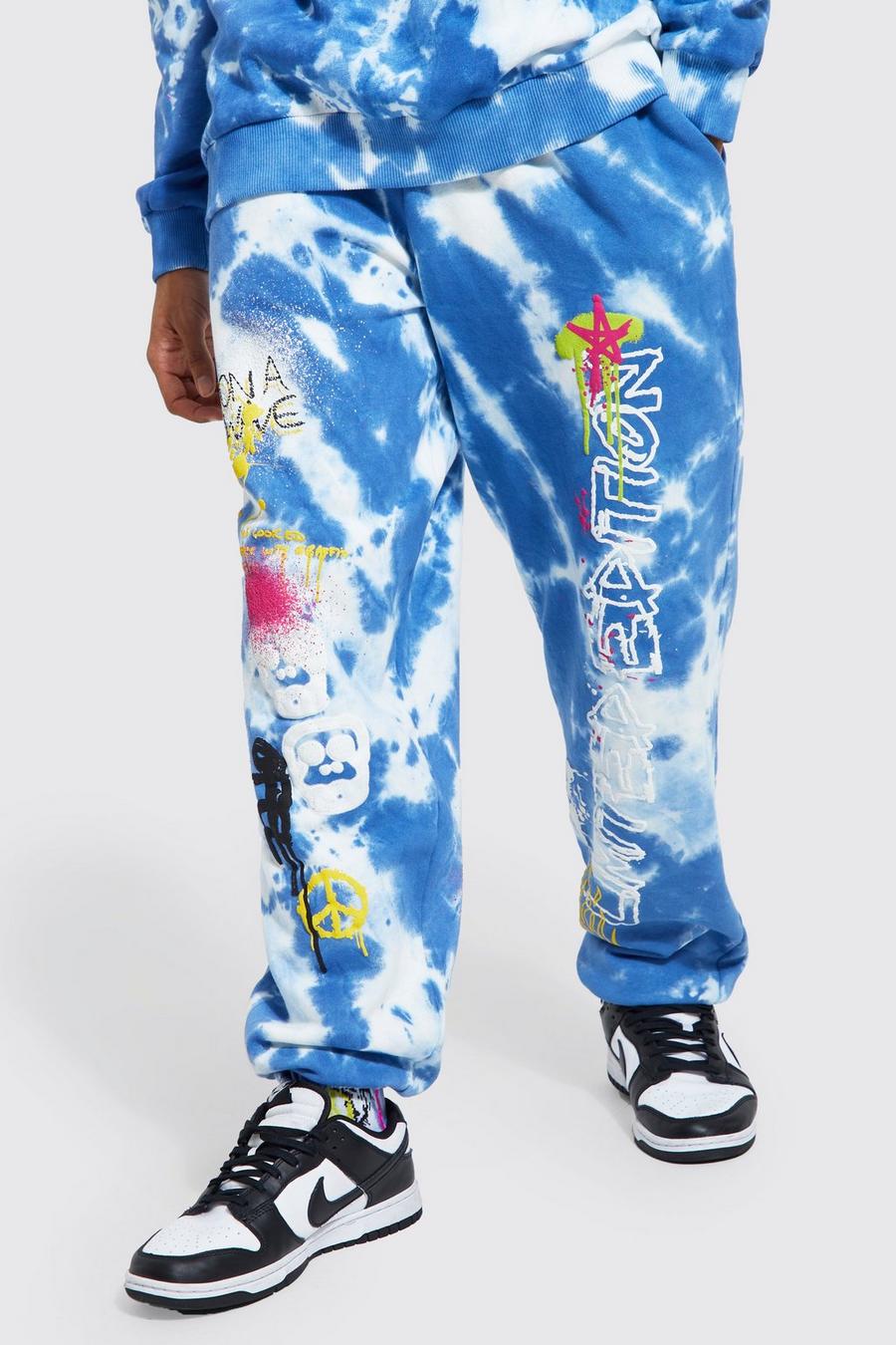 Blue Oversized Graffiti Graphic Tie Dye Joggers image number 1