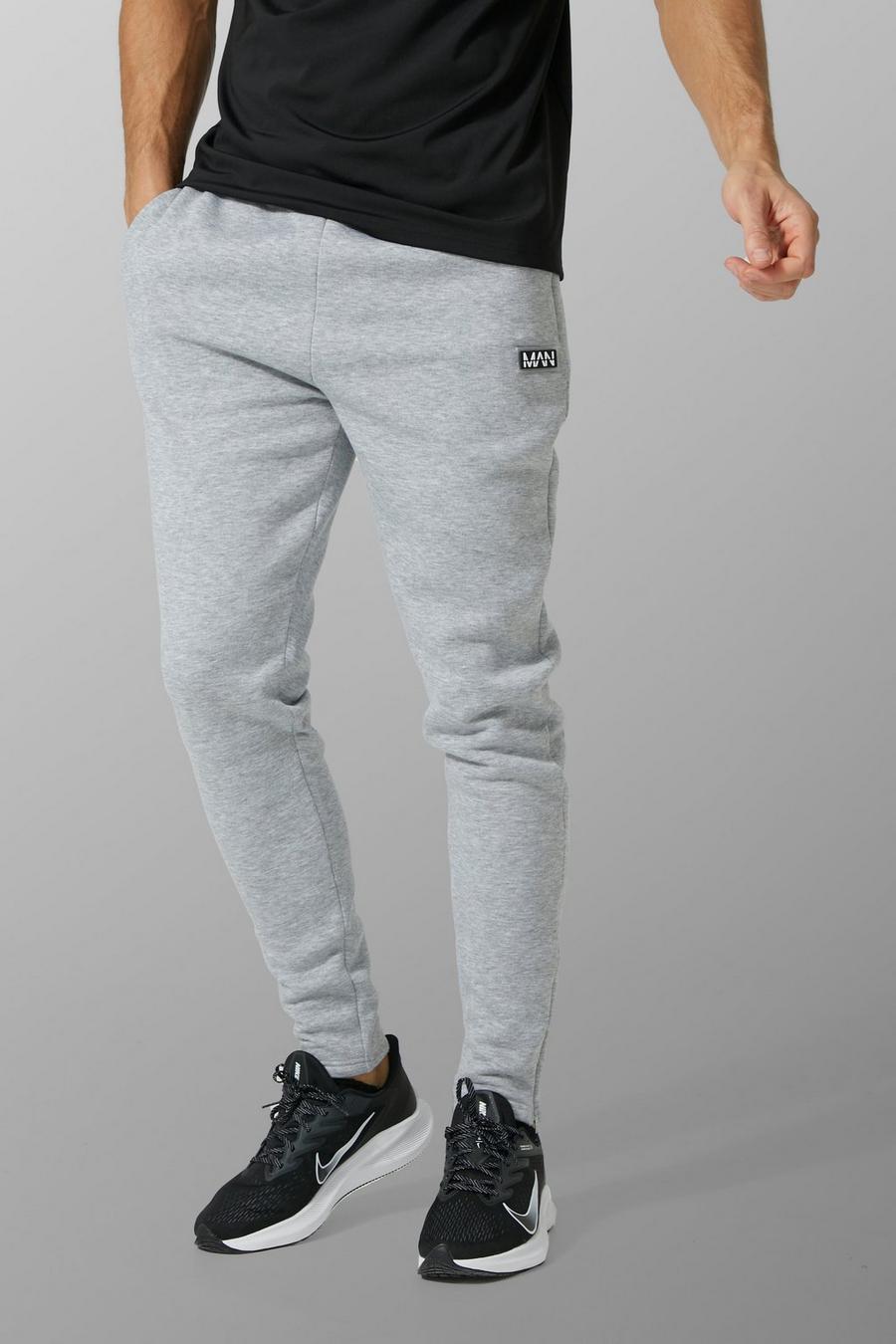 סלע אפור gris מכנסי ריצה ספורטיביים לאימונים עם כיתוב Man, לגברים גבוהים image number 1