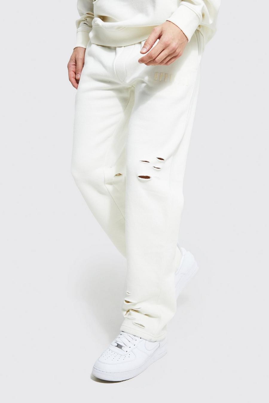 שמנת bianco מכנסי ריצה אוברסייז בגזרה רחבה עם קרעים וכיתוב Official 