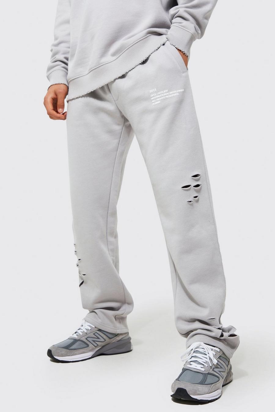 Pantaloni tuta a gamba ampia Man oversize effetto smagliato, Grey image number 1