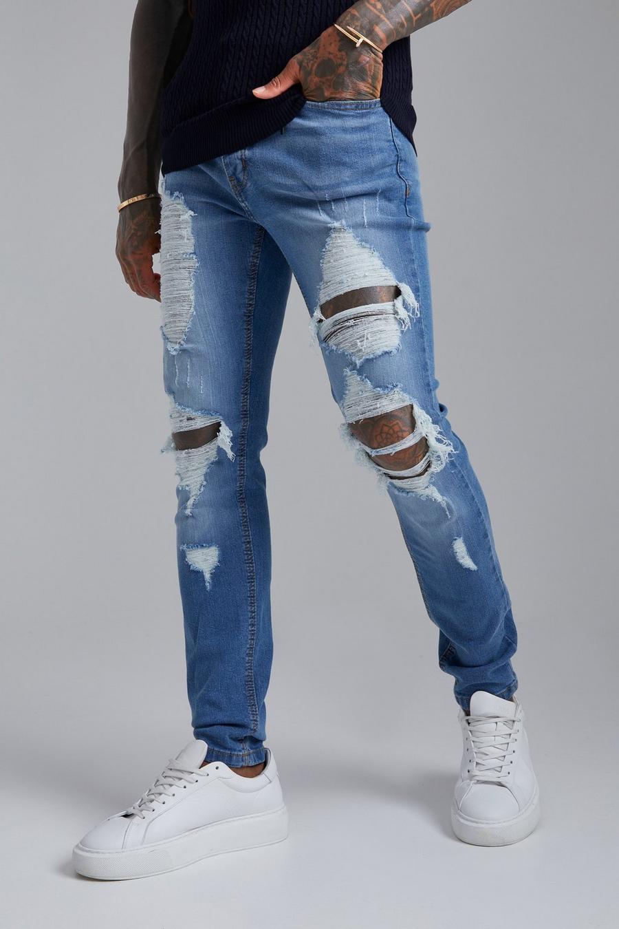 Light blue Skinny jeans med slitna knän och stretch image number 1