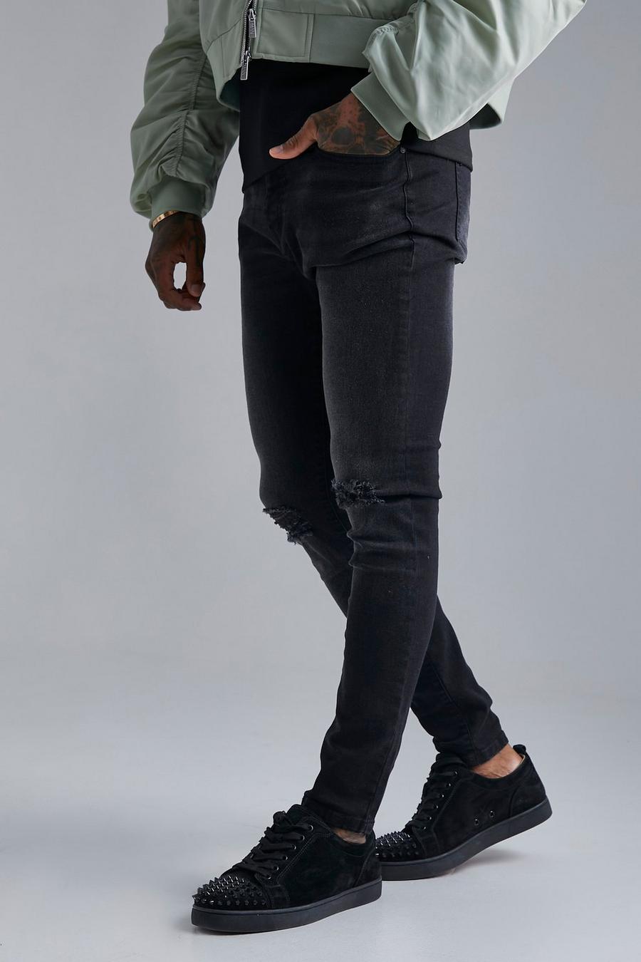 שחור דהוי סקיני ג'ינס סטרץ' עם קרע בברך image number 1