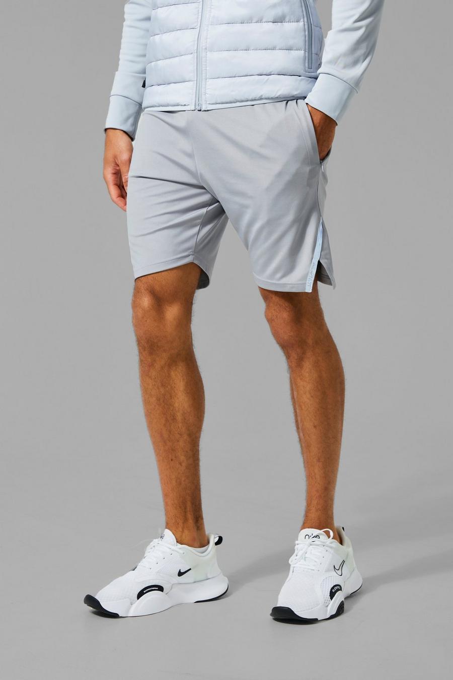 Ash grey MAN Active Shorts med reflexdetaljer image number 1