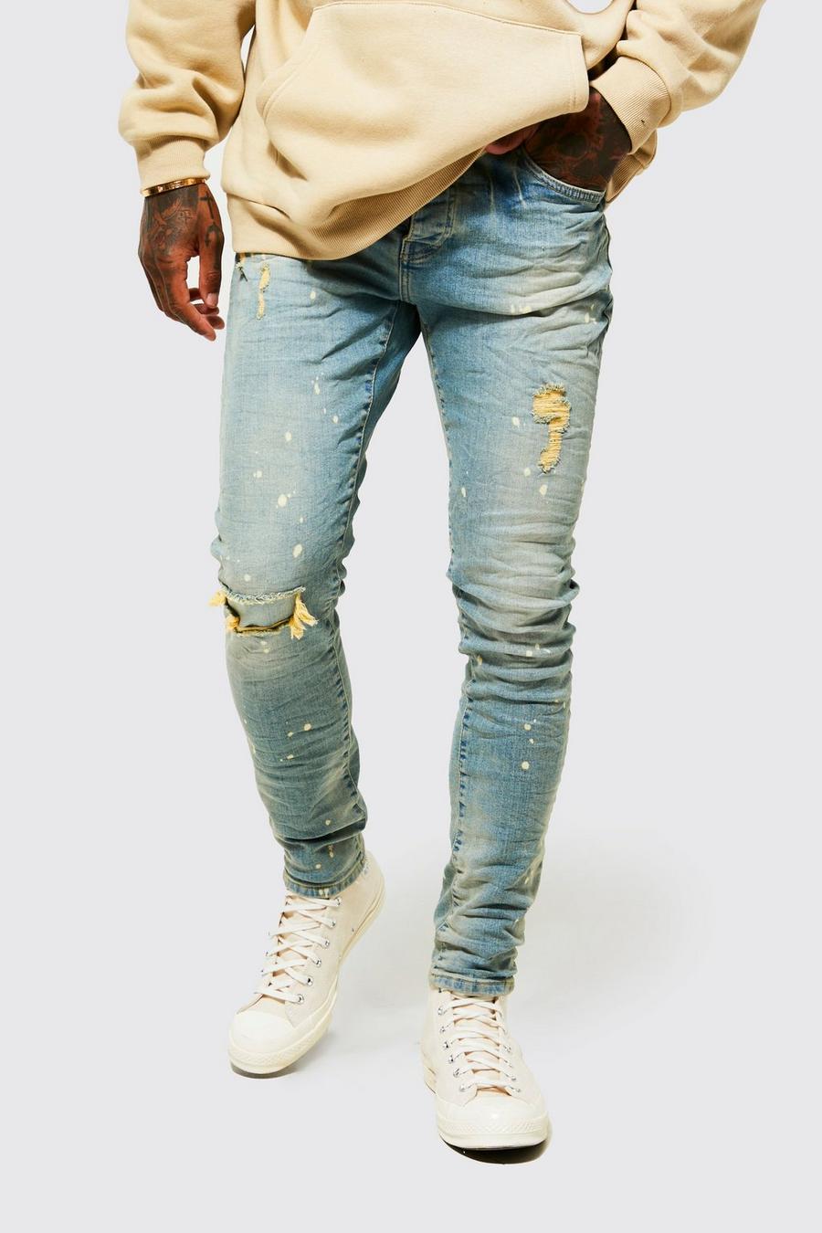 Jeans Skinny Fit effetto goffrato con spacco sul ginocchio e schizzi di colore, Antique wash azzurro