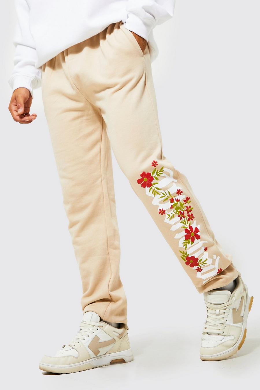 Sand Regular Fit Floral Worldwide Graphic Joggers image number 1