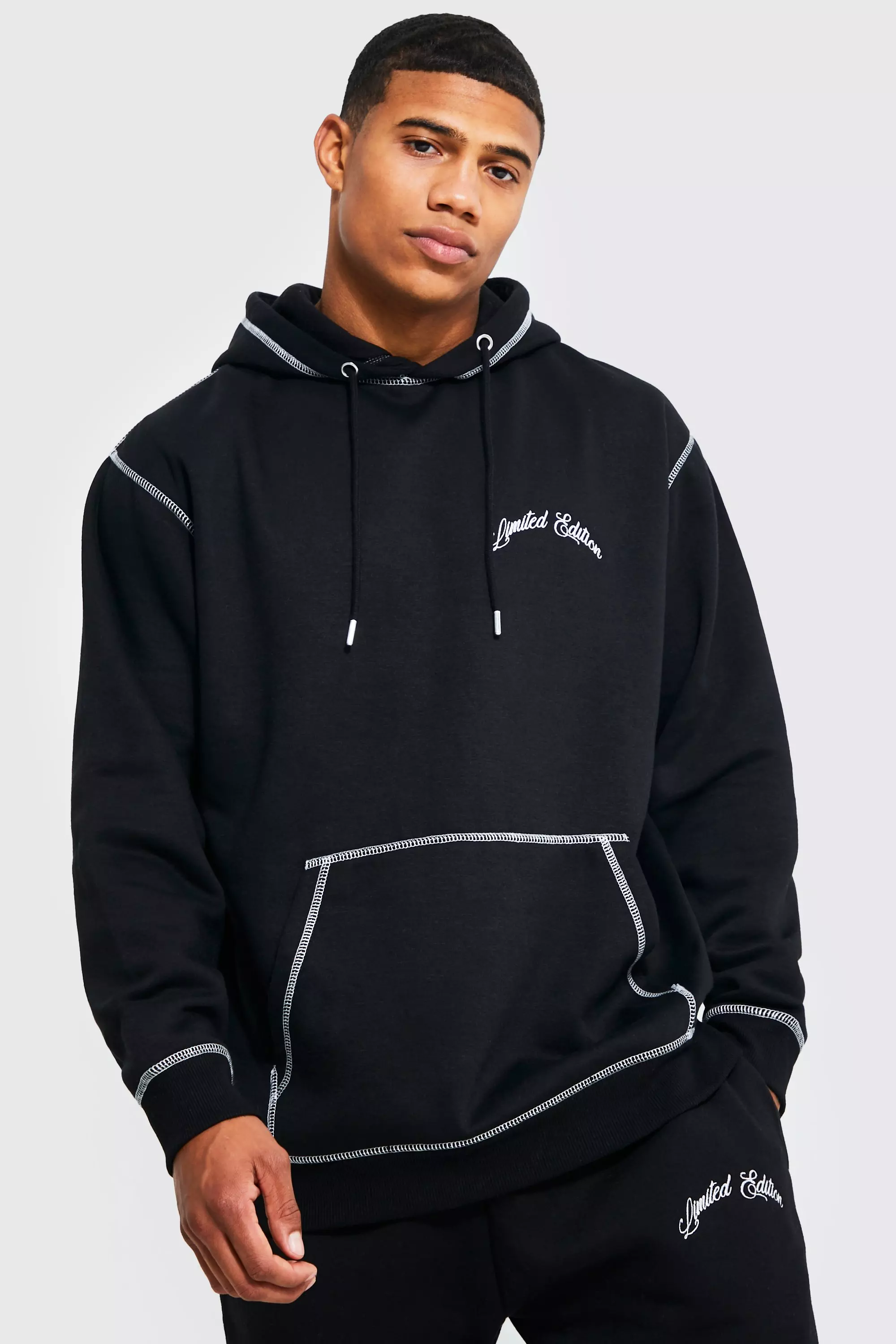 Black hoodie with store white stitching