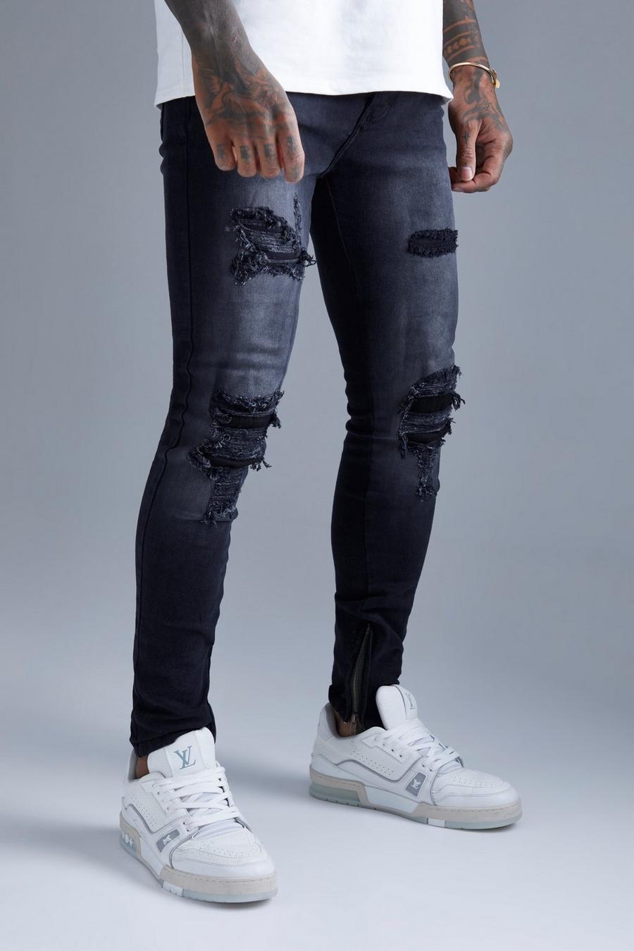 Washed black Super Skinny All Over Rip And Repair Jeans image number 1