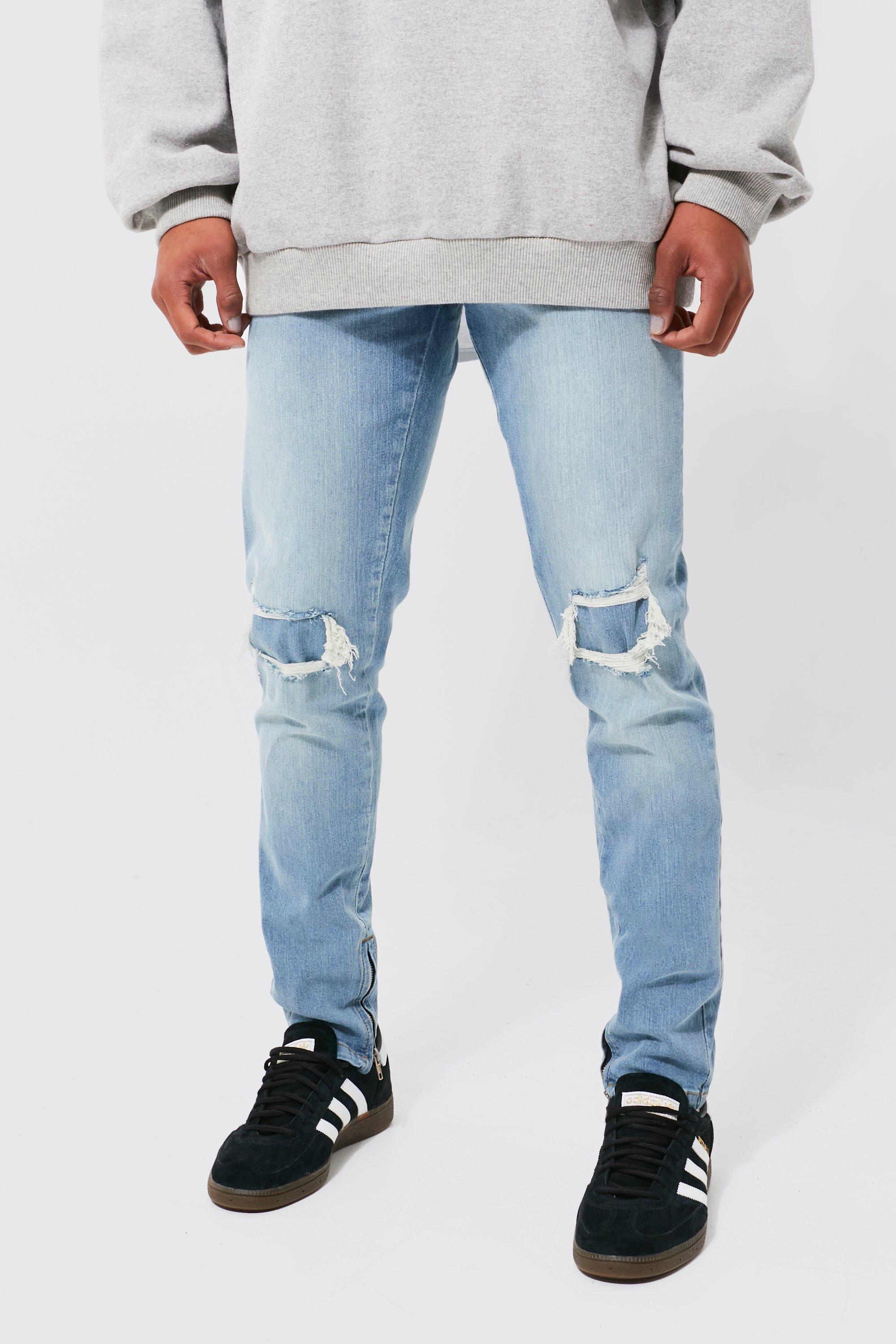 LIGHT BLUE JEANS - RIPPED AND REPAIRED