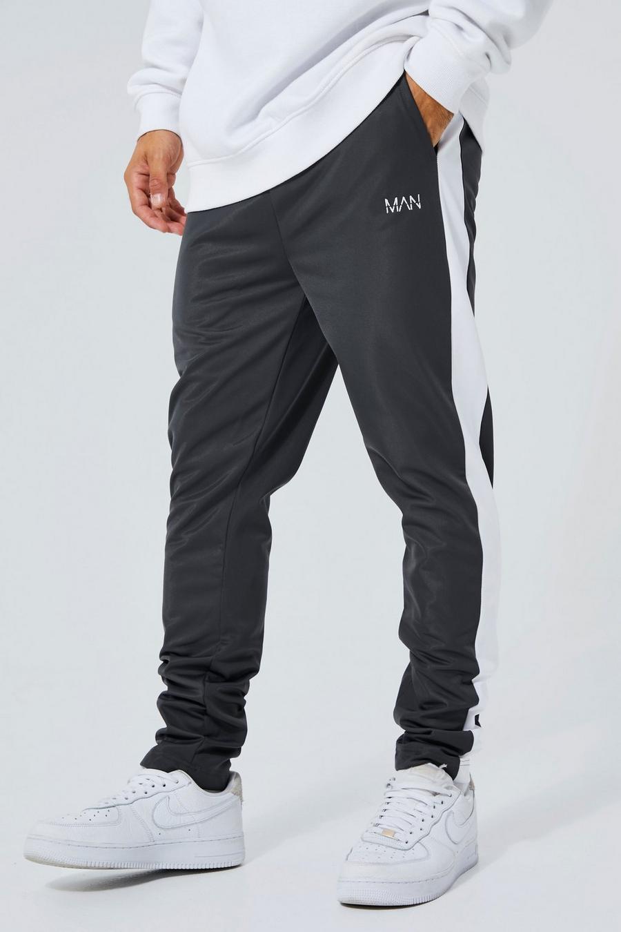Pantalón deportivo MAN pitillo con panel lateral de tejido por urdimbre, Dark grey image number 1