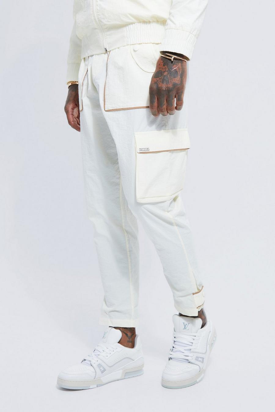 Pantalón deportivo de tela shell elástica con ribete, Ecru blanco image number 1