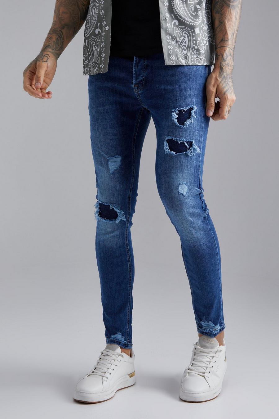 Indigo Slitna skinny jeans med lagningar image number 1