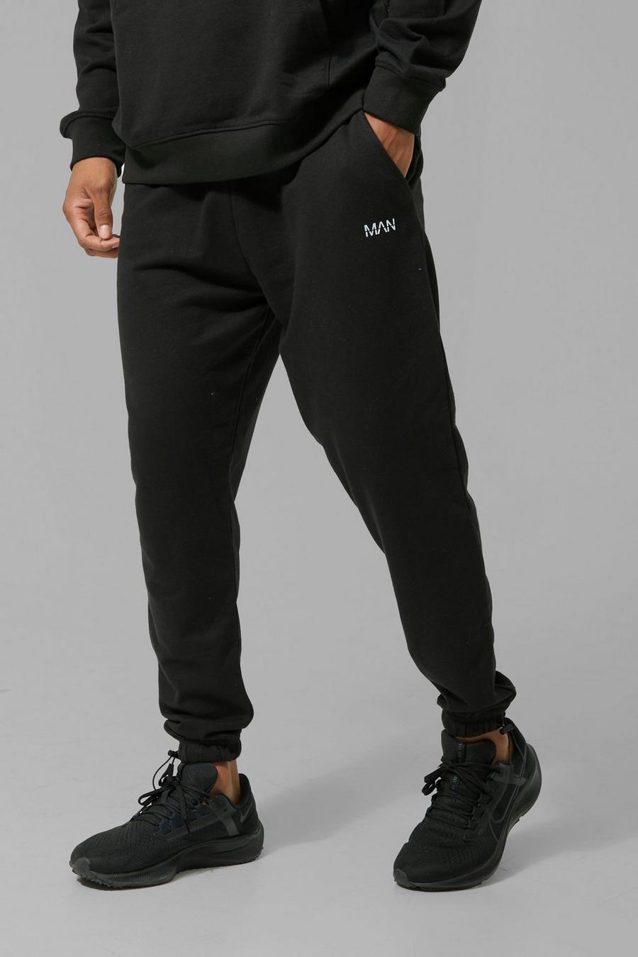 Pantaloni tuta Man Active con polsini alle caviglie e fermacorde, Black image number 1
