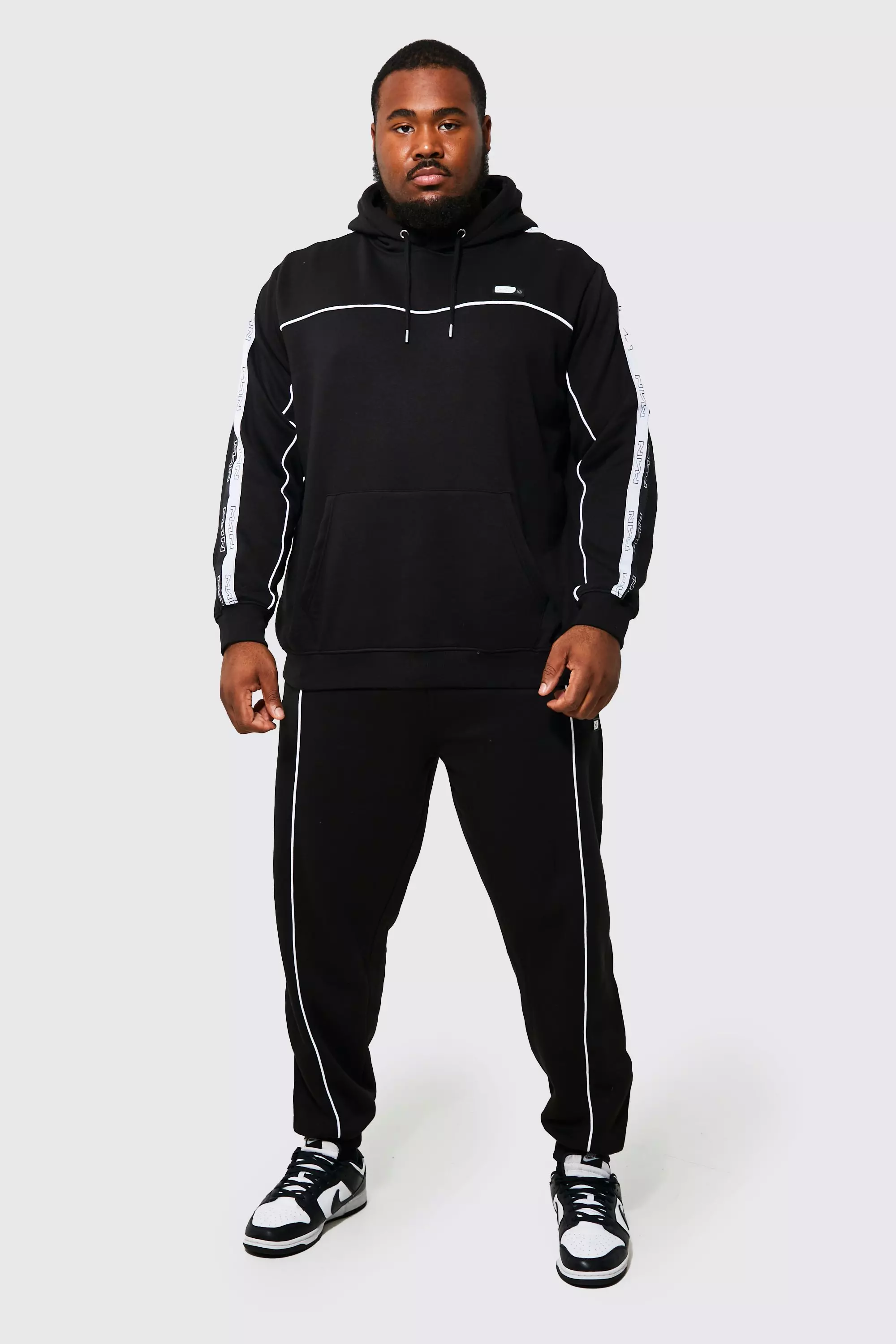 Nike black best sale tape tracksuit