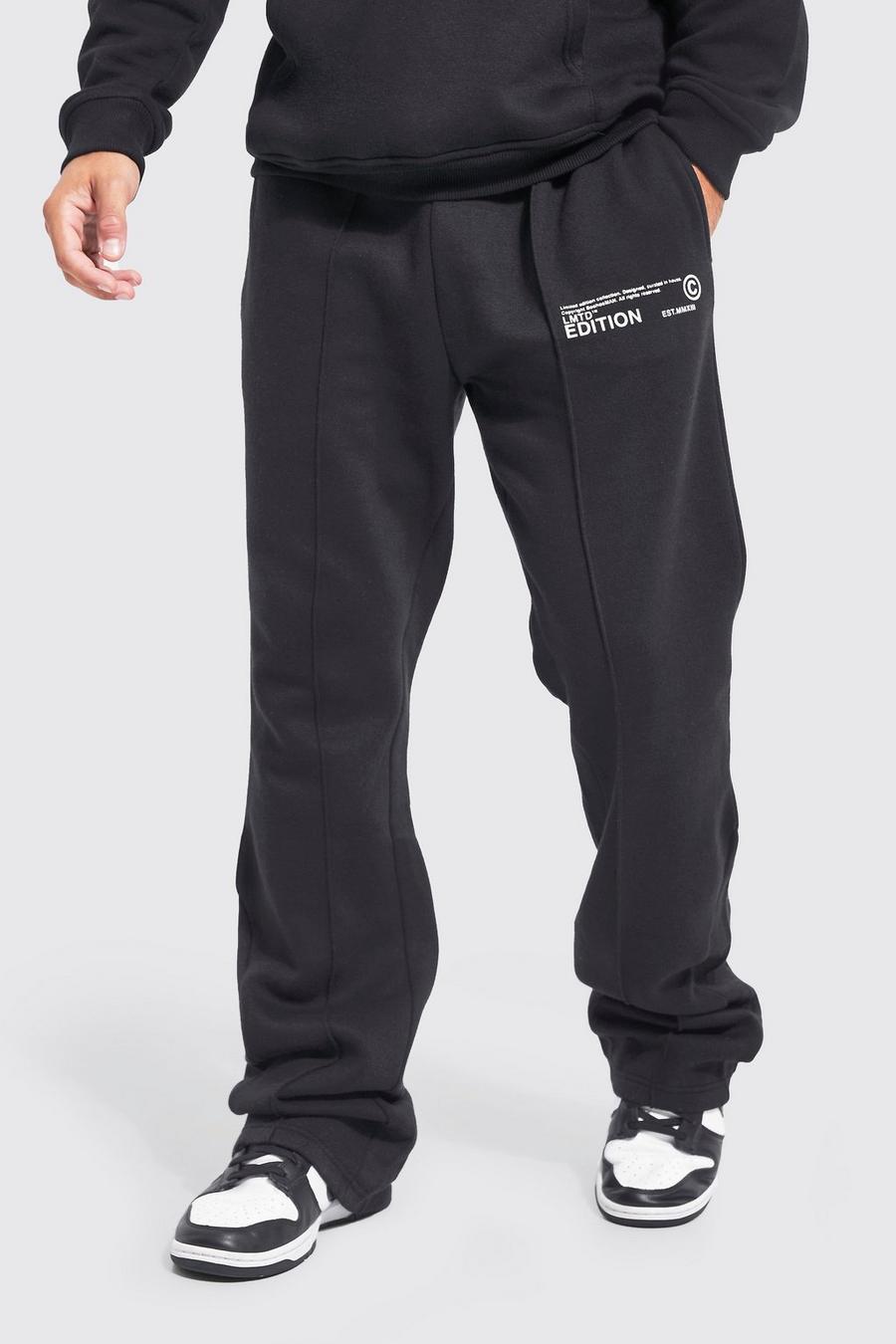 Pantaloni tuta Man Slim Fit con nervature e pieghe sul fondo, Black image number 1