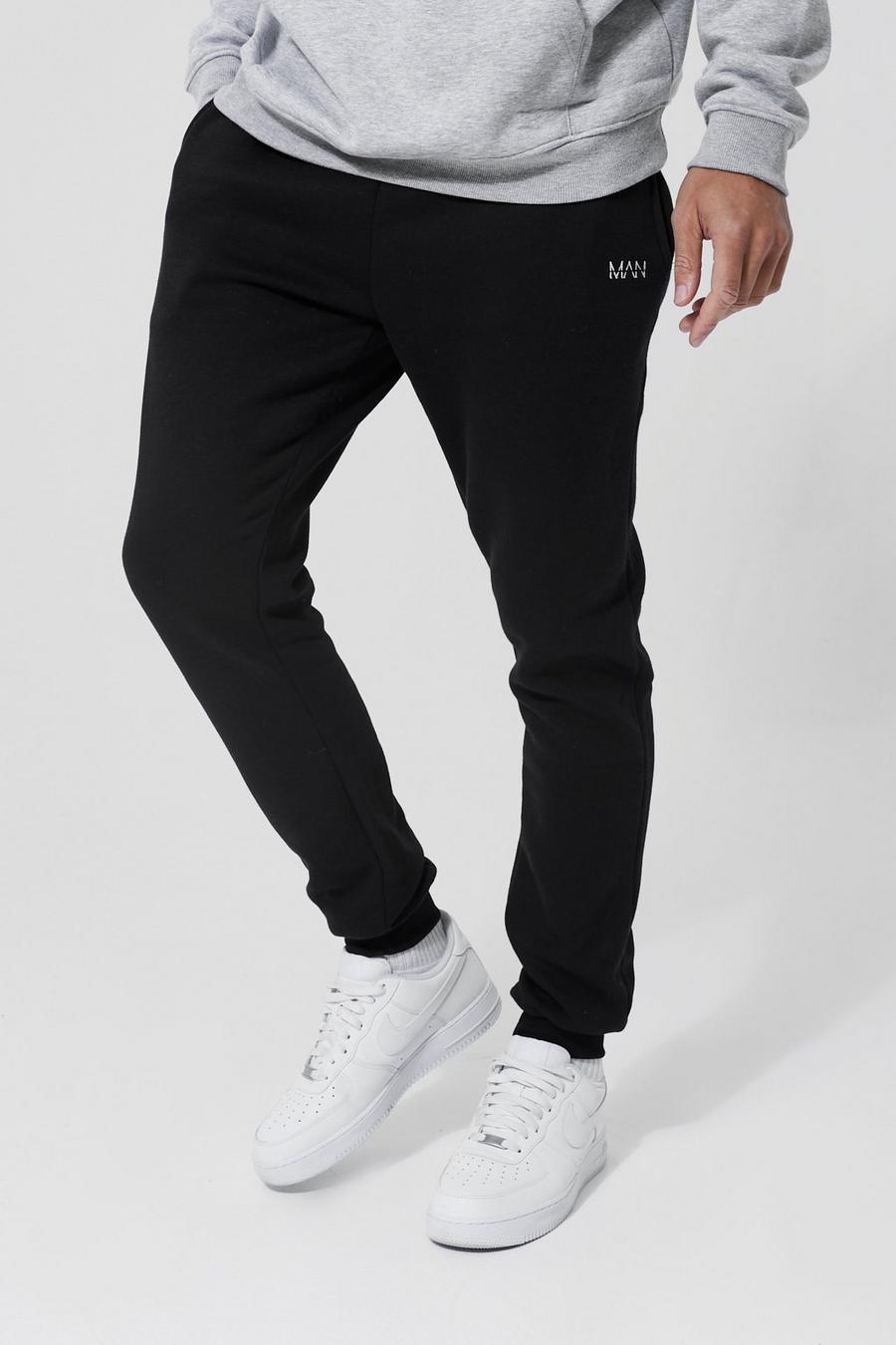 Pantalón deportivo Tall básico pitillo con letras MAN, Black image number 1