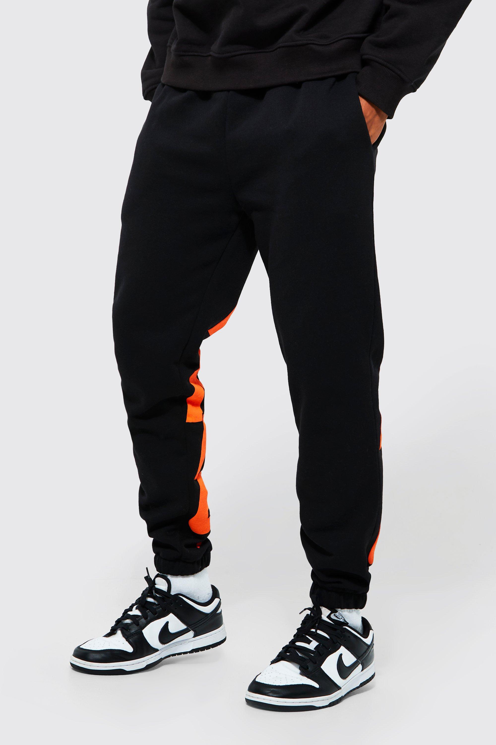 Black joggers with orange clearance stripe