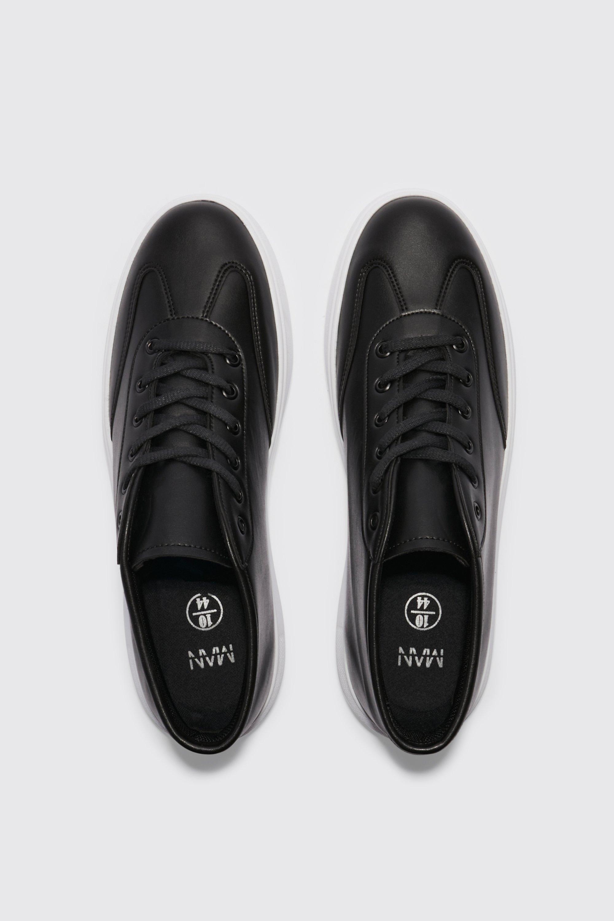 Black mid top outlet trainers