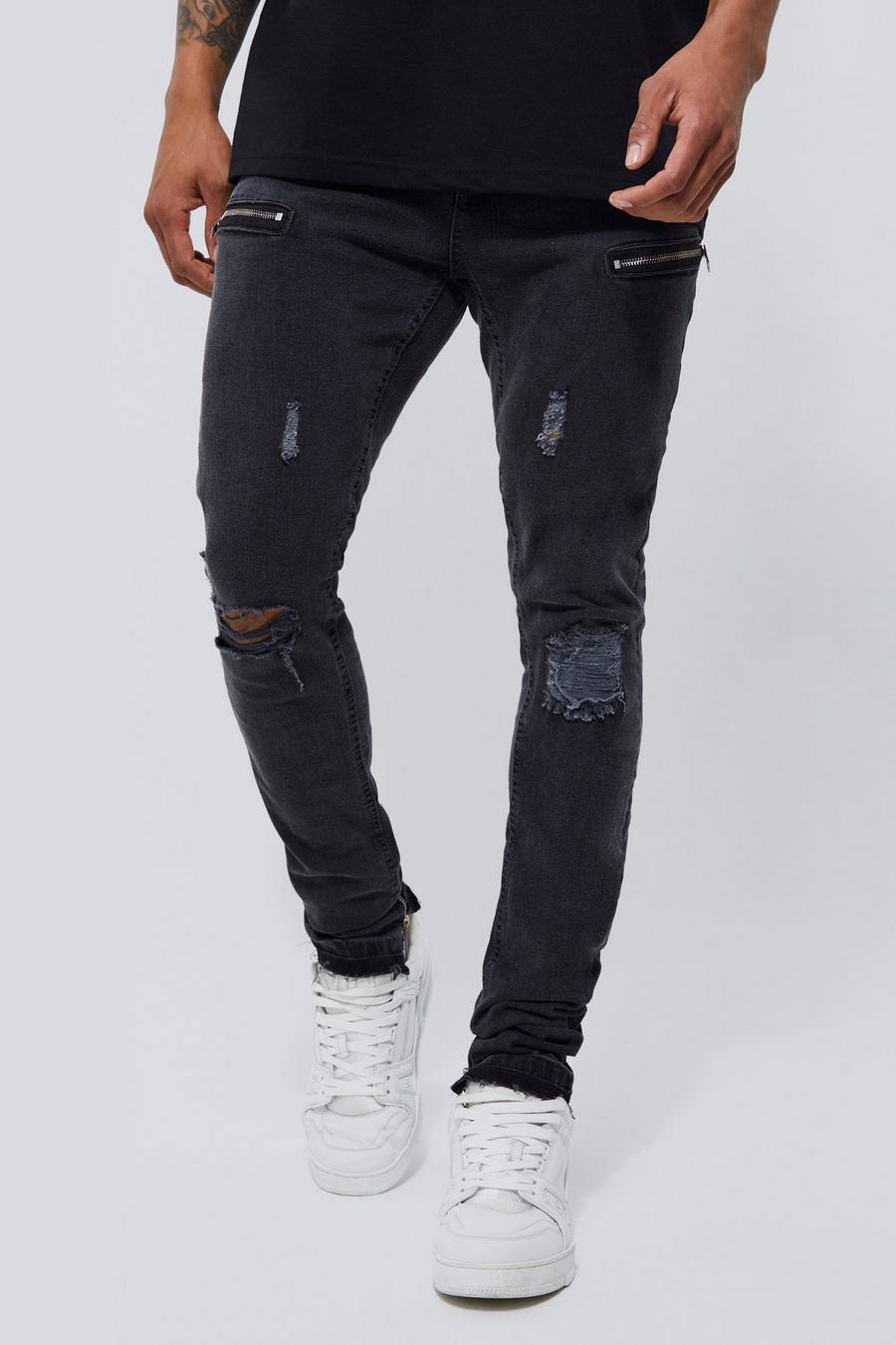 Mid grey skinny stretch stacked jeans with knee rips