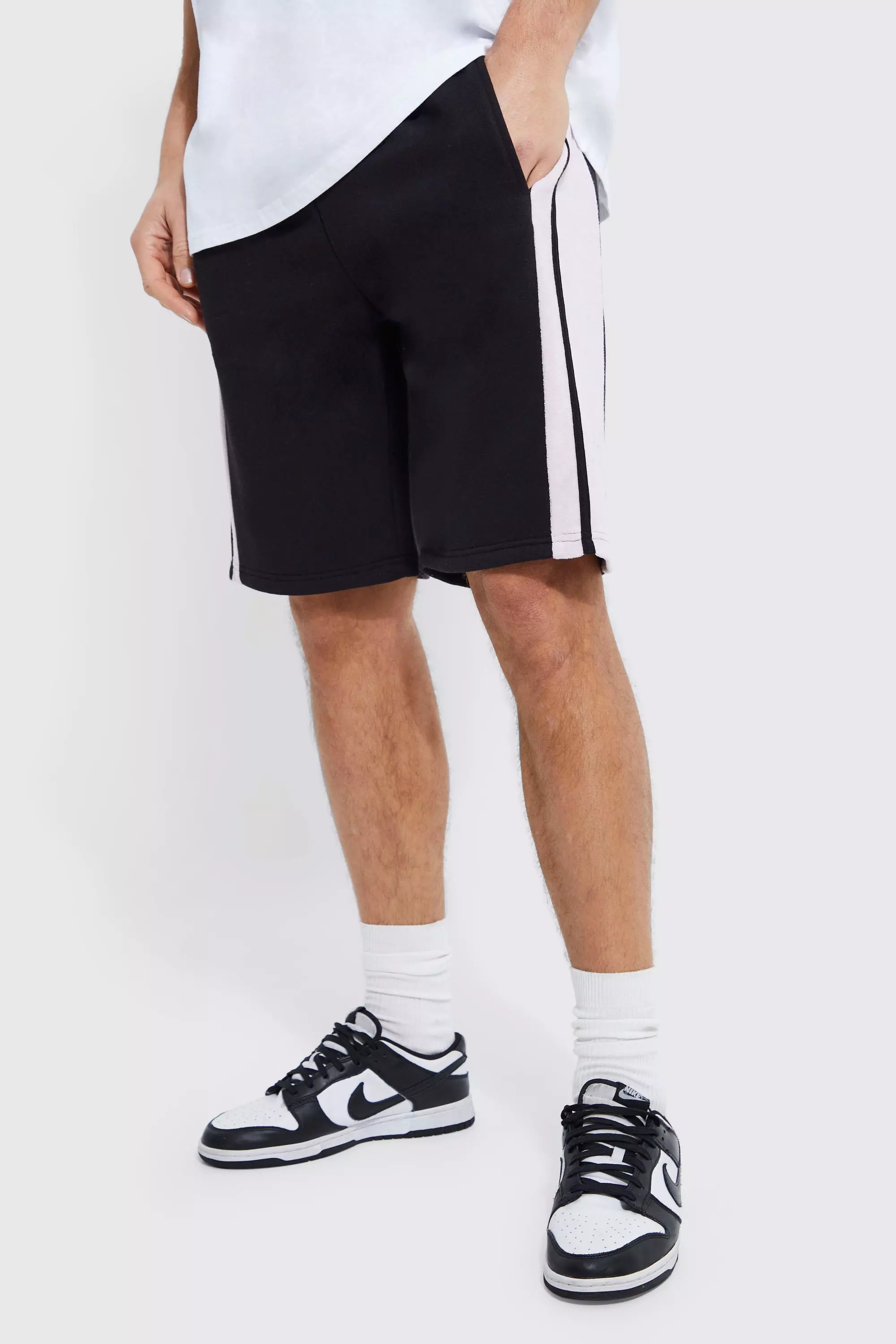 Black shorts with white stripe hot sale on side