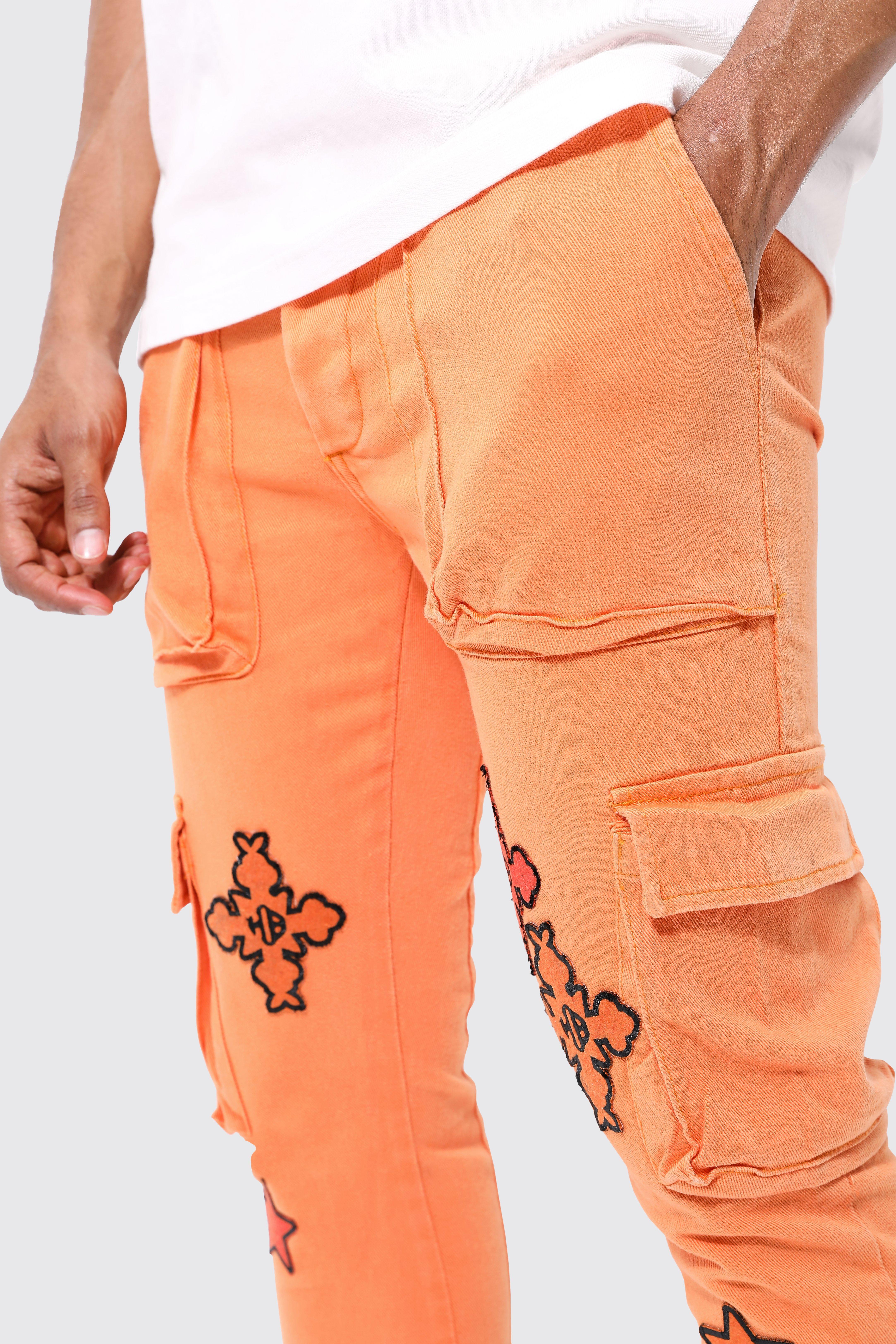 https://media.boohoo.com/i/boohoo/bmm44046_orange_xl_3/male-orange-fixed-waist-skinny-flare-cargo-applique-trouser