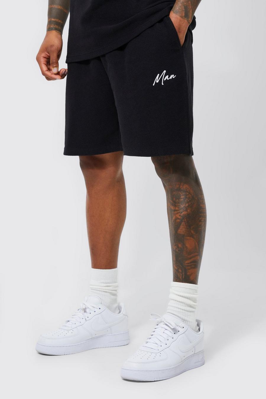 Black MAN Shorts i jersey med ledig passform image number 1