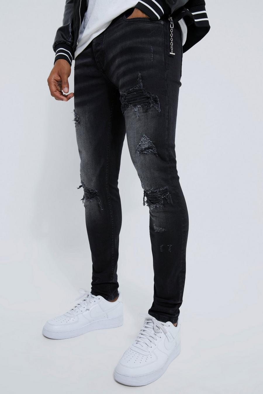 Washed black Slitna skinny jeans med lagningar och stretch image number 1