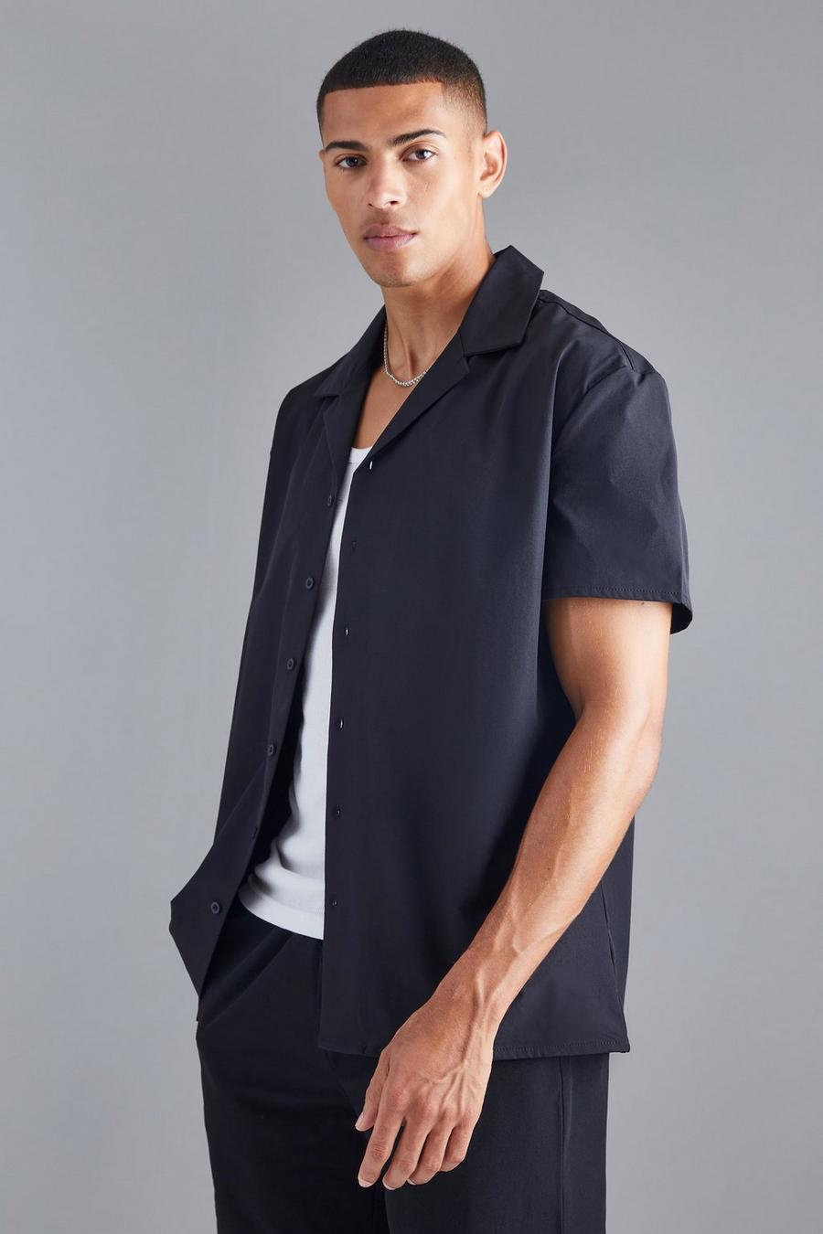 Camisa oversize técnica elástica de manga corta, Black negro
