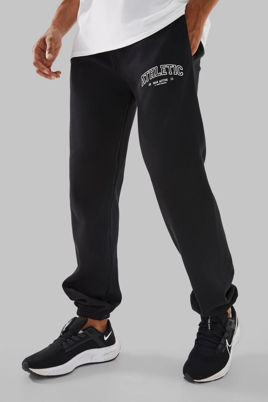Pantalón deportivo MAN Active oversize con estampado Athletic, Black image number 1