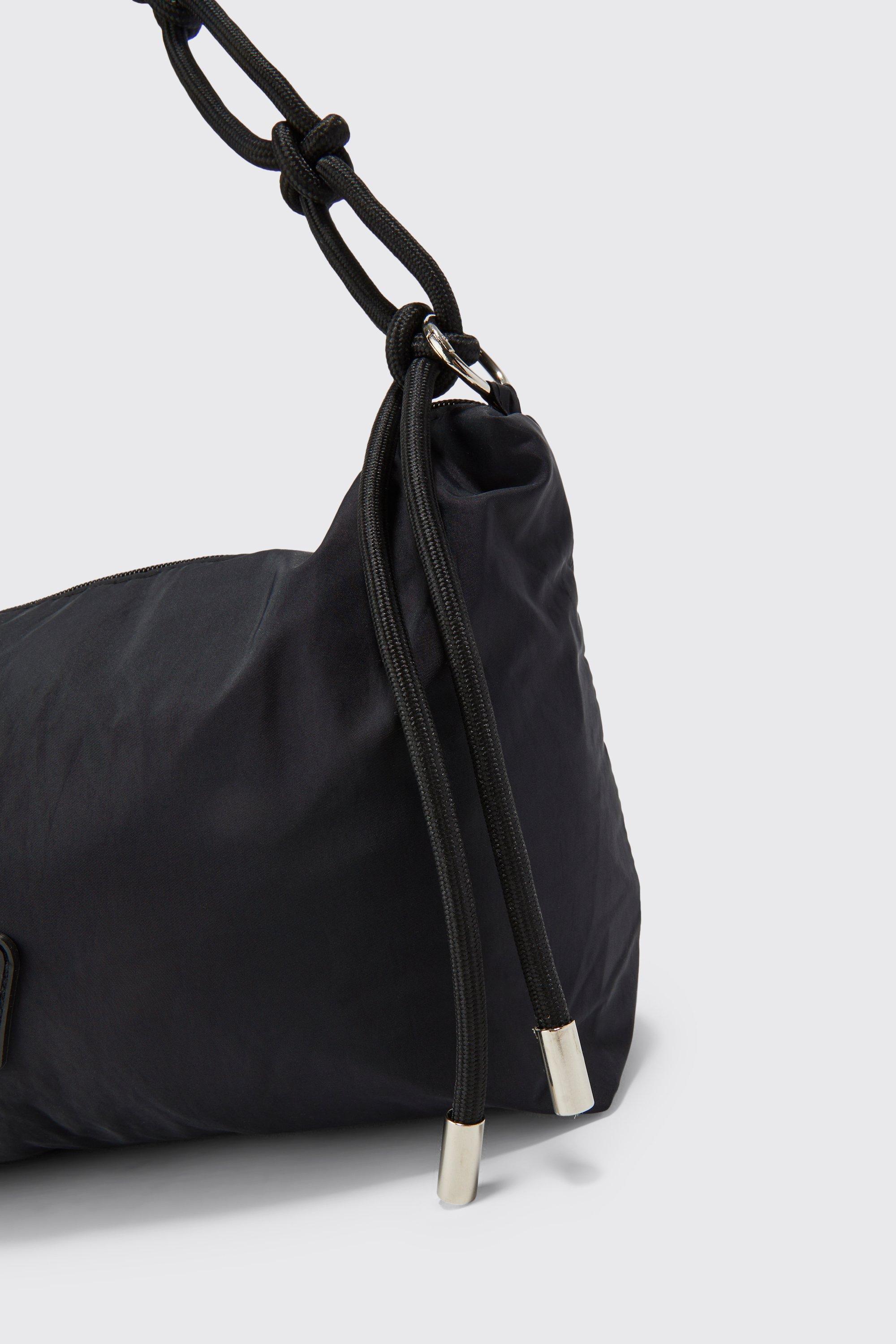 Sling backpack clearance with rope strap