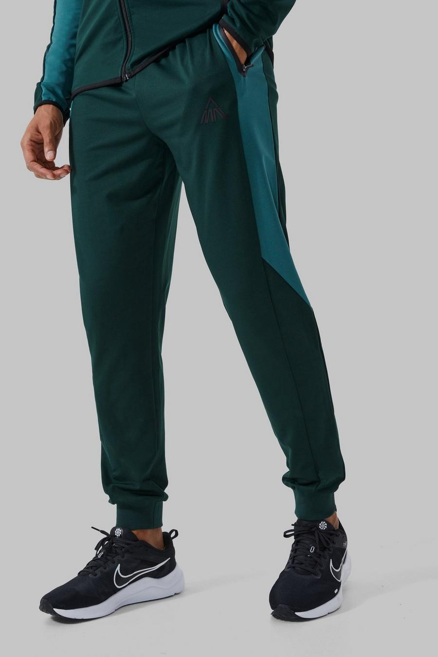 Pantaloni tuta Man Active a blocchi di colore con pannelli, Forest image number 1