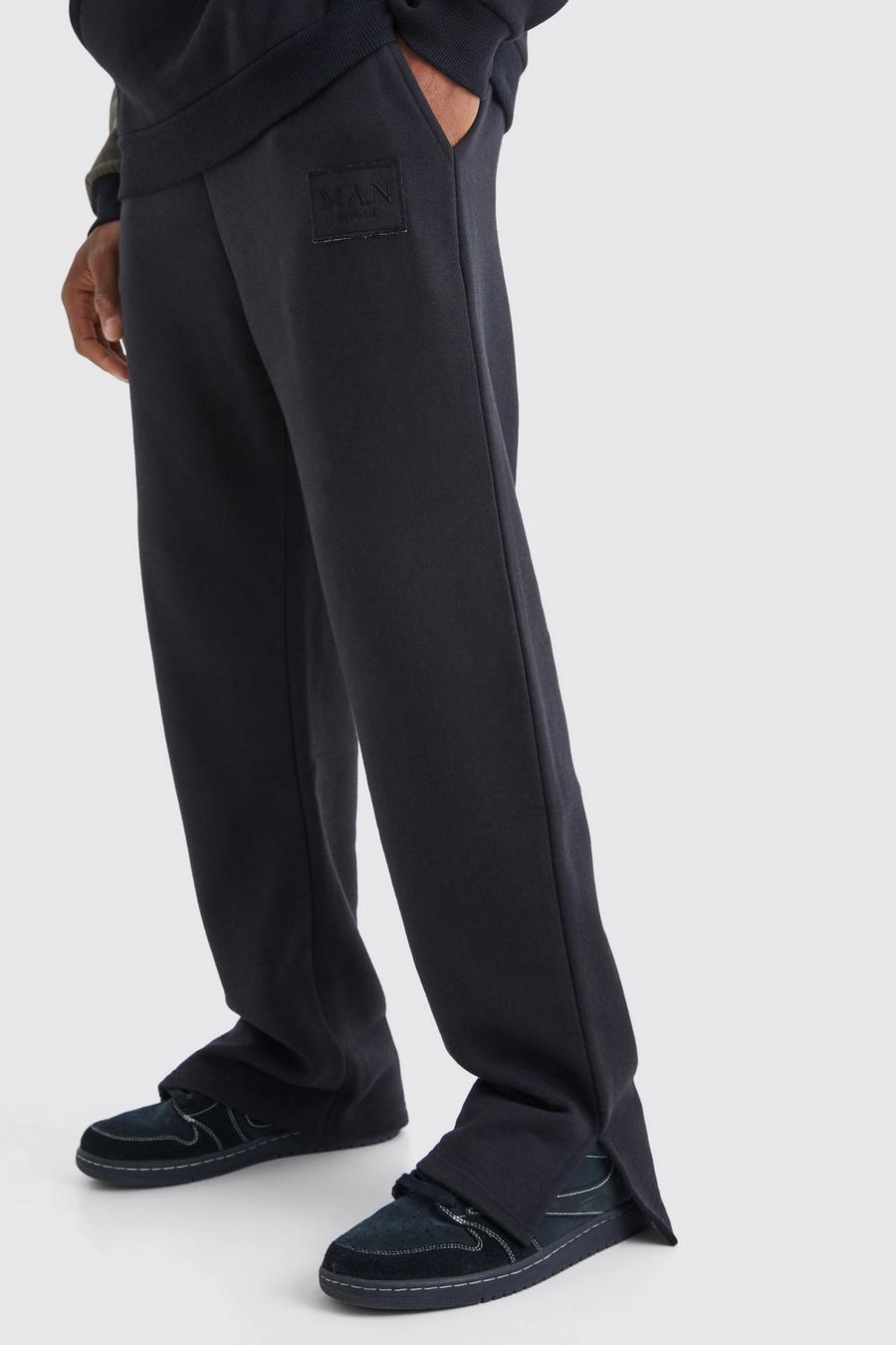 Pantaloni tuta con spacco sul fondo e stemma a effetto consumato, Black image number 1