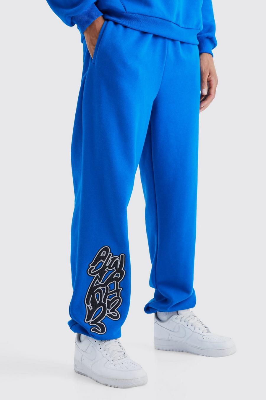 Pantalón deportivo Tall oversize con estampado Worldwide de grafiti, Cobalt