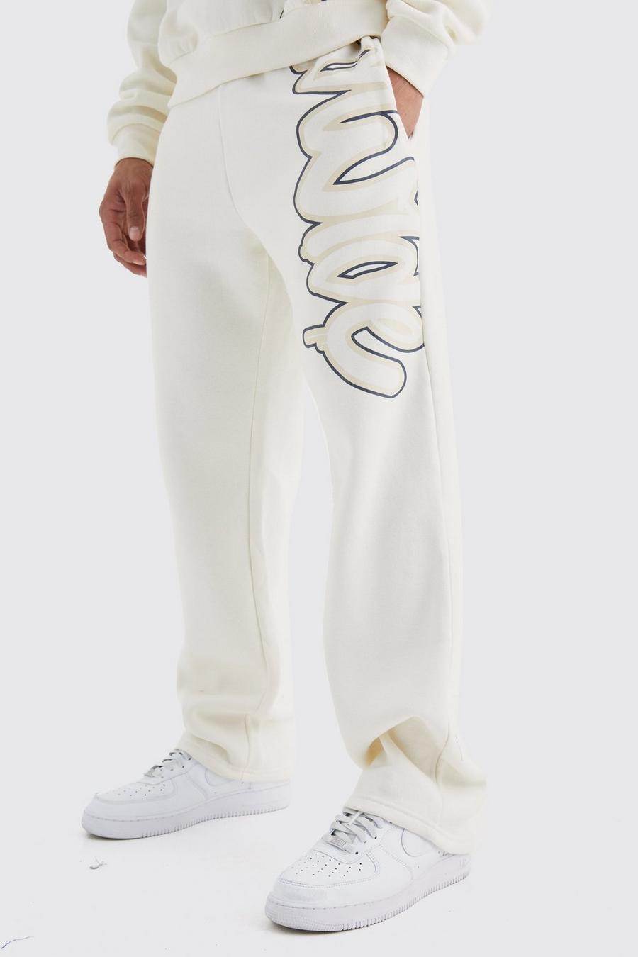 Pantalón deportivo holgado con estampado Worldwide de grafiti, Ecru image number 1