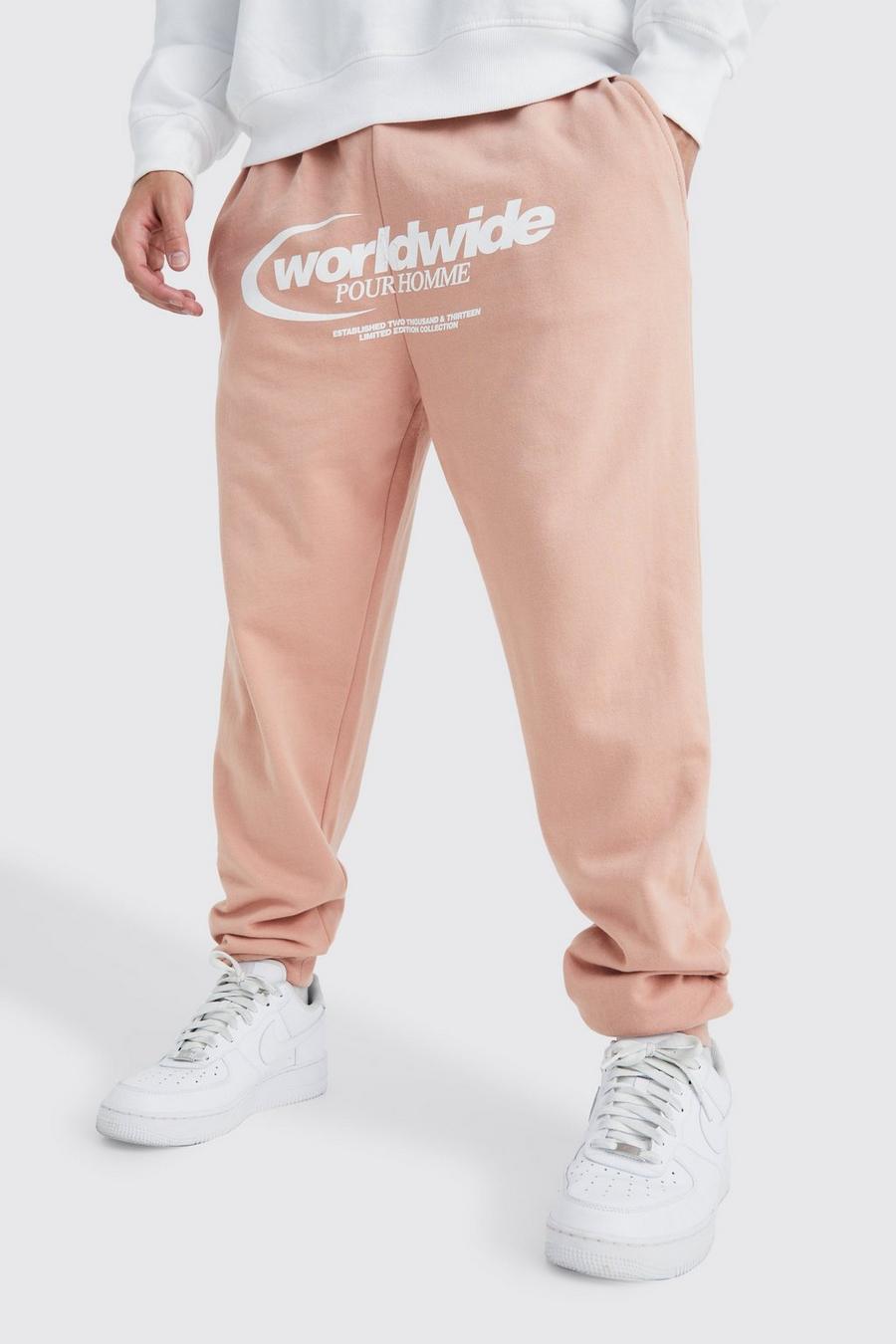 Pantaloni tuta oversize con grafica Worldwide, Dusty pink