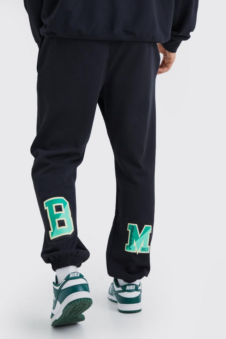 Pantalón deportivo oversize con estampado gráfico universitario, Black image number 1