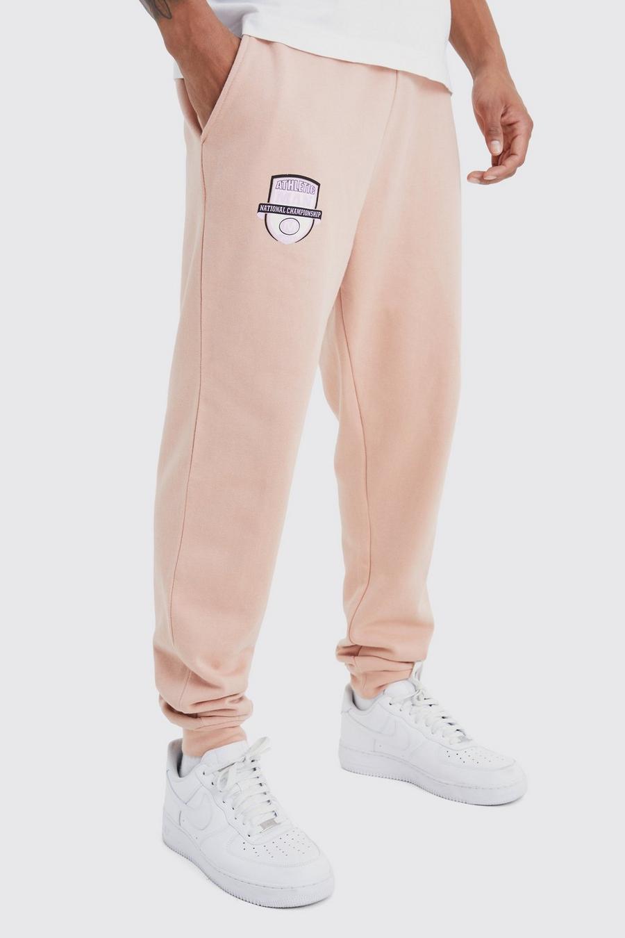 Pantalón deportivo oversize con estampado gráfico universitario, Dusty pink image number 1