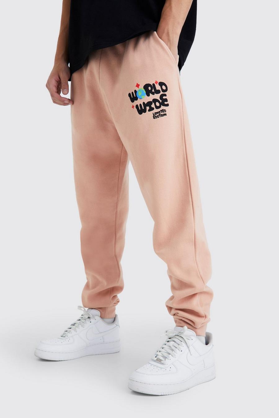 Pantalón deportivo oversize con estampado gráfico Worldwide, Dusty pink image number 1