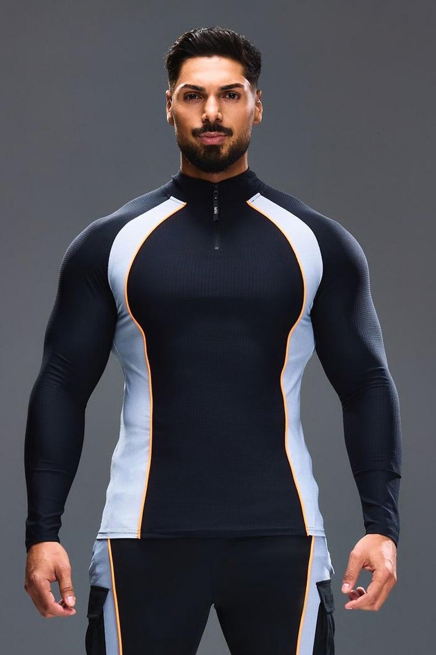 Man Active Slim-Fit Colorblock Trainingsoberteil mit 1/4 Reißverschluss, Black image number 1
