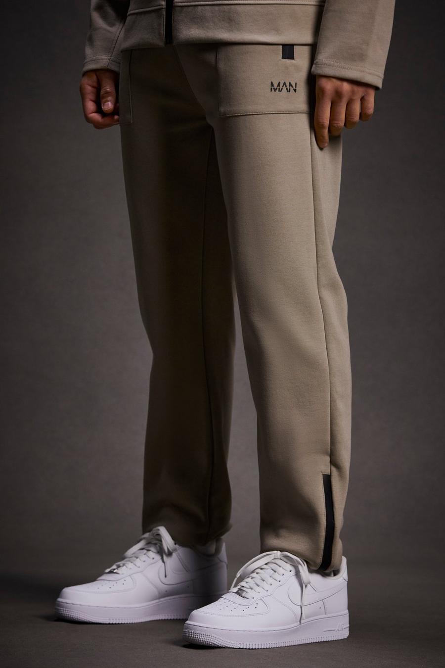 Pantaloni tuta Man Active Tech con zip sul fondo, Stone image number 1
