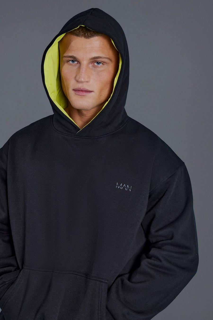 Black MAN Active Oversize hoodie med geometriskt mönster image number 1