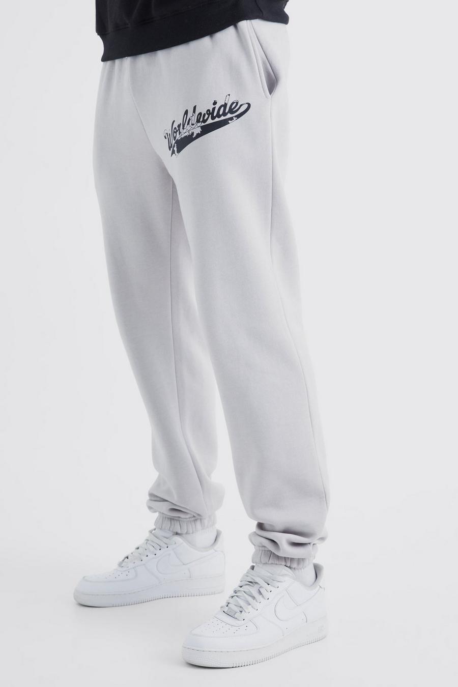Pantaloni tuta Tall con stampa Worldwide vintage con spacco sul fondo, Light grey