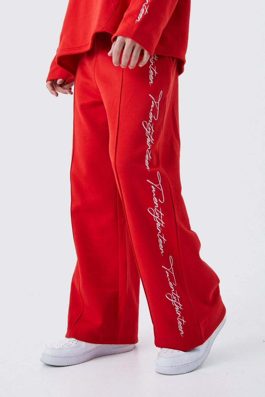 Pantaloni tuta a gamba ampia con scritta ricamata e fondo grezzo, Red